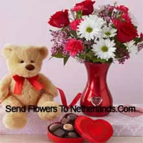 Red Roses And White Gerberas With Some Ferns In A Glass Vase Along With A Cute 12 Inches Tall Brown Teddy Bear And An Imported Box Of Chooclates