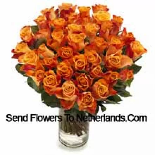 51 Orange Roses With Seasonal Fillers In A Glass Vase