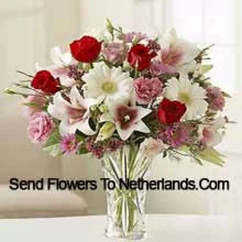 Red Roses, Pink Carnations White Gerberas And White Lilies With Other Assorted Flowers In A Glass Vase
