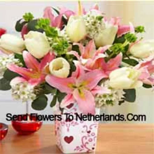Pink Lilies And White Tulips With Assorted White Fillers In A Glass Vase - Please Note That In Case Of Non-Availability Of Certain Seasonal Flowers The Same Will Be Substituted With Other Flowers Of Same Value