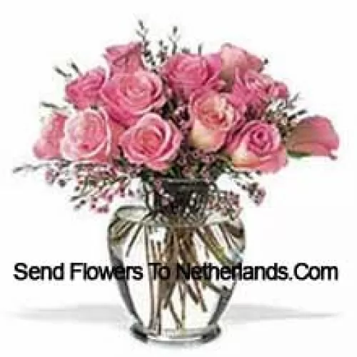 Bunch Of 11 Pink Roses With Some Ferns In A Vase