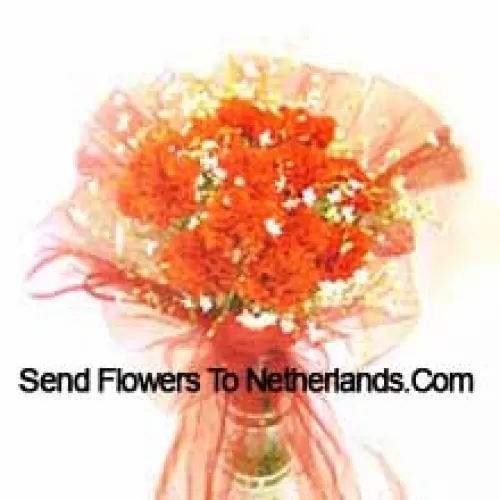 11 Orange Carnations With Some Ferns In A Vase