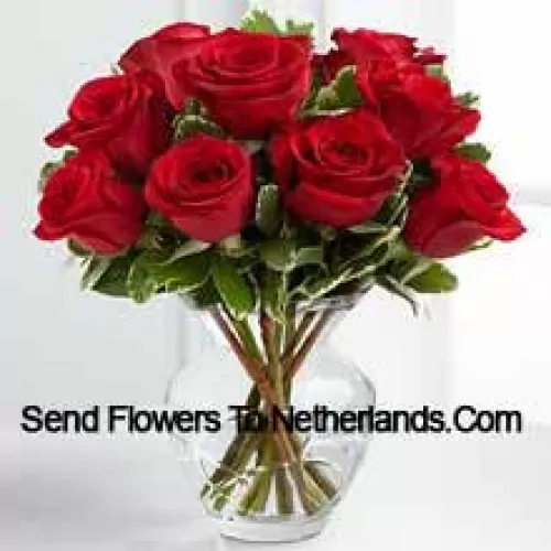 9 Red Roses With Some Ferns In A Vase