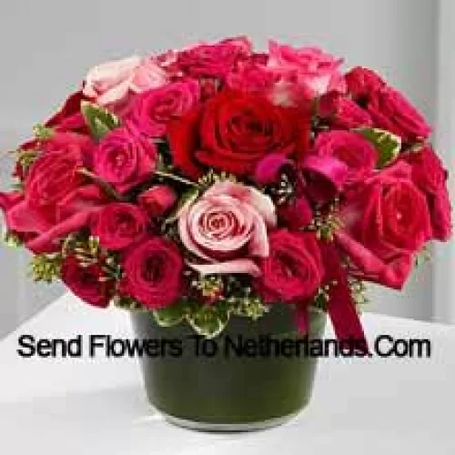 A Beautiful Basket Of Red, Dark Pink And Light Pink Roses. This Basket Has In Total 24 Roses.